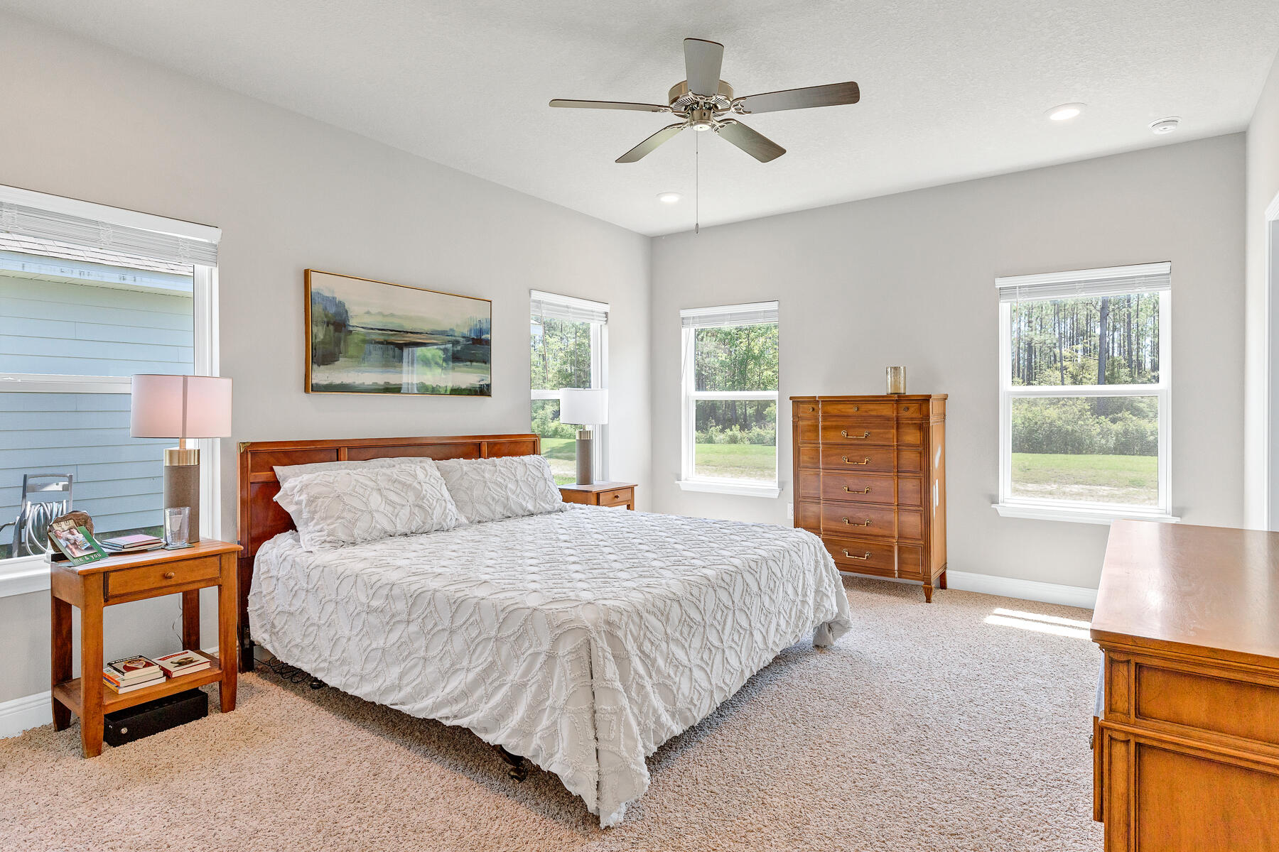 186 Southern Pnes Road Santa Rosa Beach, FL 32459 - Photo 14 of 32 a bedroom with a large bed a lamp and a window