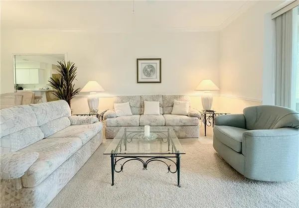 a living room with furniture and a couch