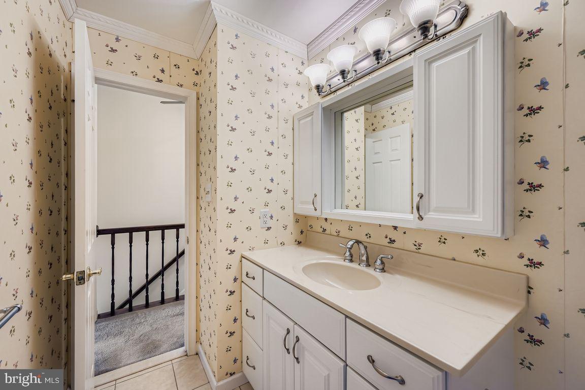 9 Bridgeview Court Baltimore, MD 21236 - Photo 13 of 27 a bathroom with a sink vanity and a mirror