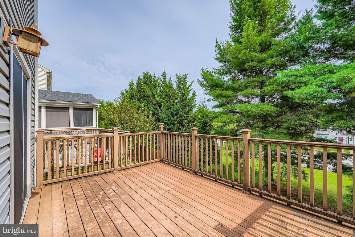 9 Bridgeview Court Baltimore, MD 21236 - Photo 24 of 27 a balcony with wooden floor and fence