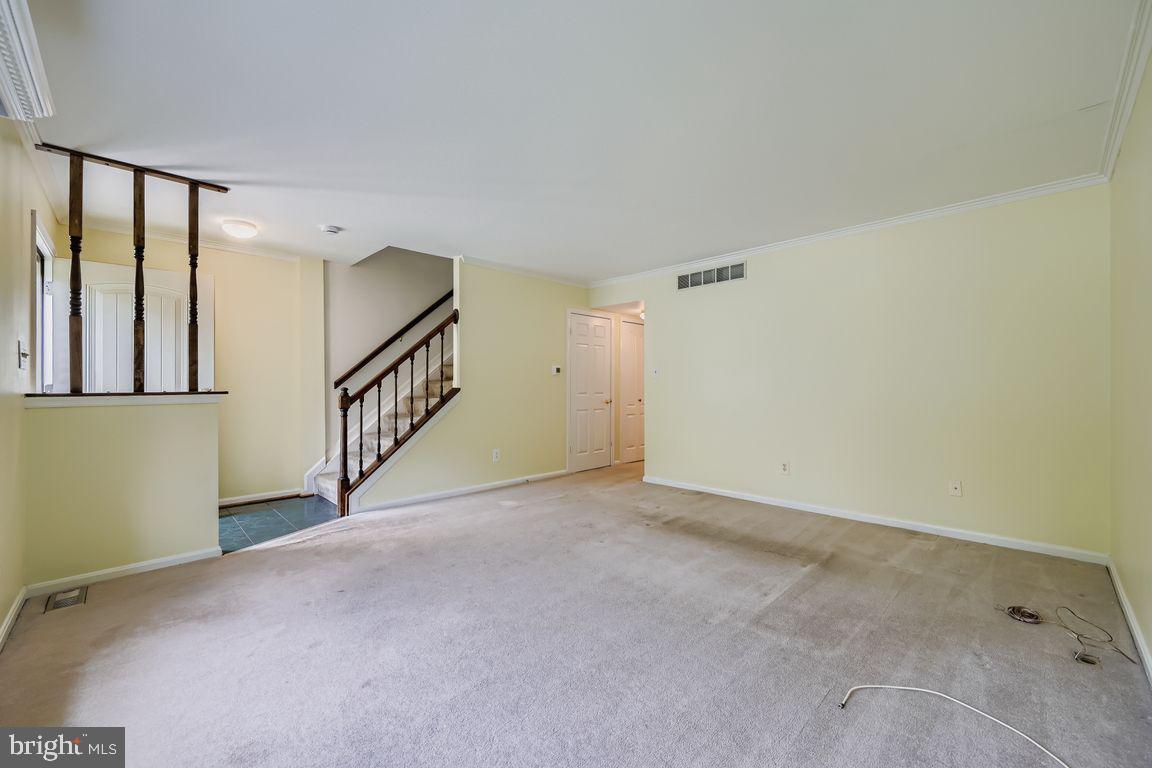 9 Bridgeview Court Baltimore, MD 21236 - Photo 5 of 27 a view of an empty room with stairs