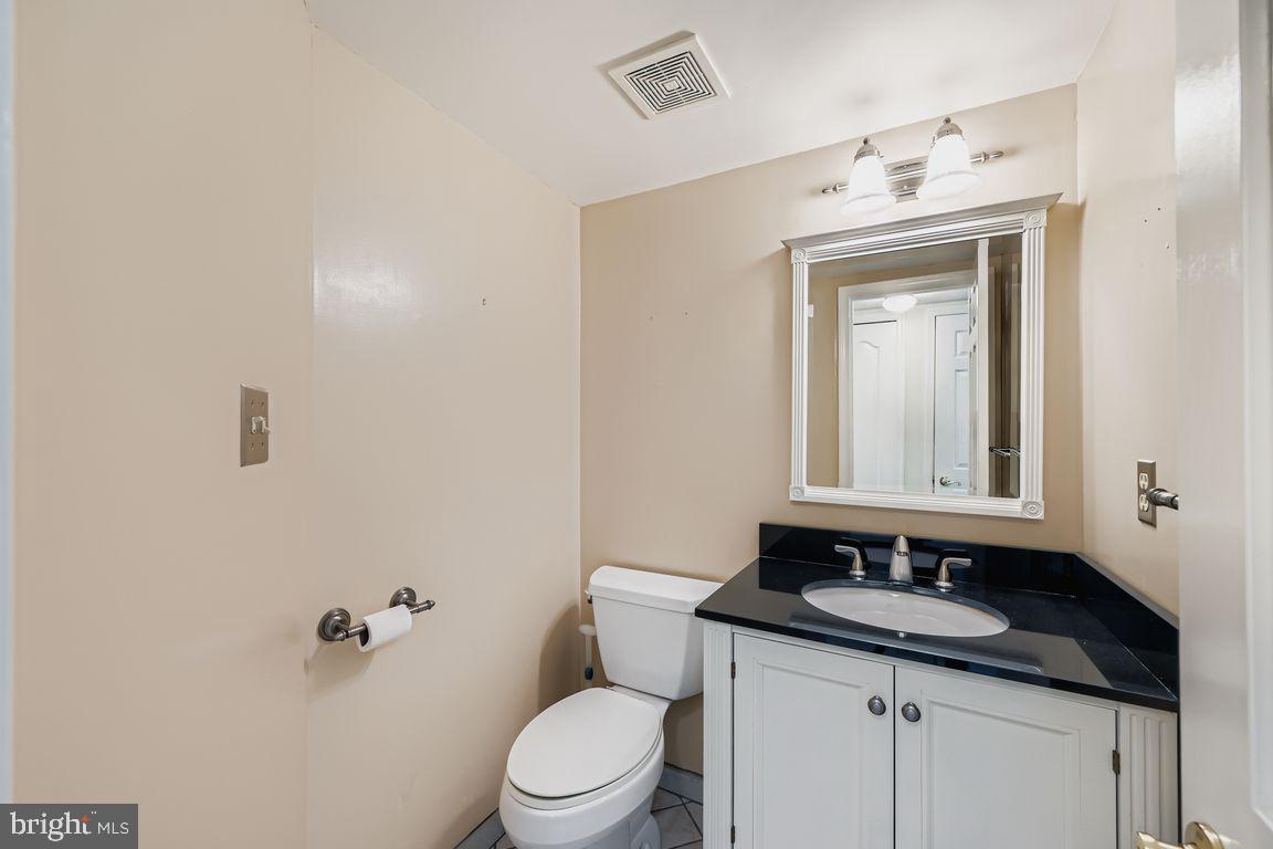 9 Bridgeview Court Baltimore, MD 21236 - Photo 10 of 27 a bathroom with a granite countertop sink and a toilet