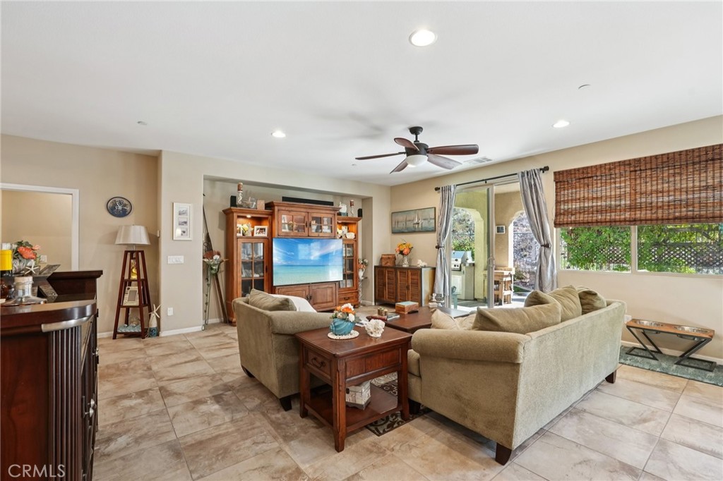 36274 Waxen Road Lake Elsinore, CA 92532 - Photo 11 of 65 a living room with furniture and a large window