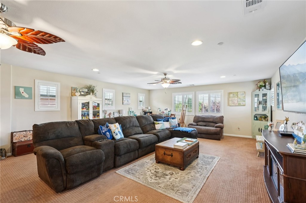 36274 Waxen Road Lake Elsinore, CA 92532 - Photo 13 of 65 a living room with furniture or couch and a window