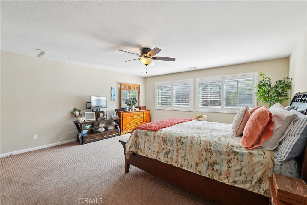 36274 Waxen Road Lake Elsinore, CA 92532 - Photo 18 of 65 a bed room with a bed and a chair