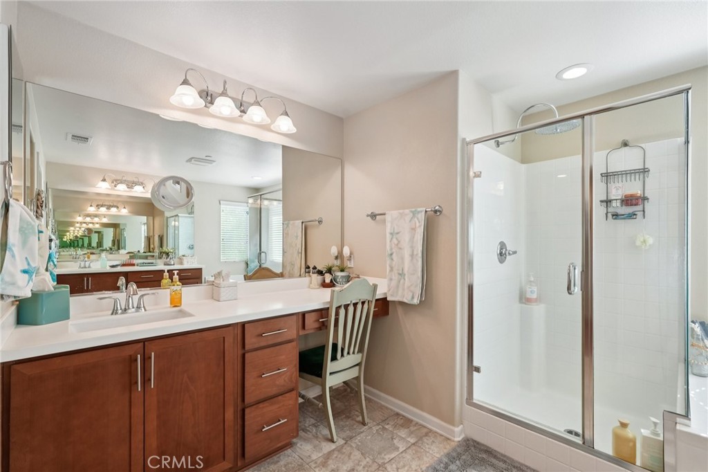 36274 Waxen Road Lake Elsinore, CA 92532 - Photo 20 of 65 a bathroom with a double vanity sink mirror and double