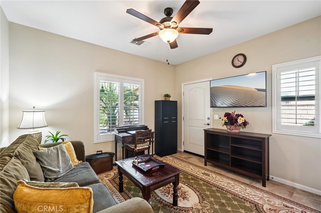 36274 Waxen Road Lake Elsinore, CA 92532 - Photo 29 of 65 a living room with furniture and a window