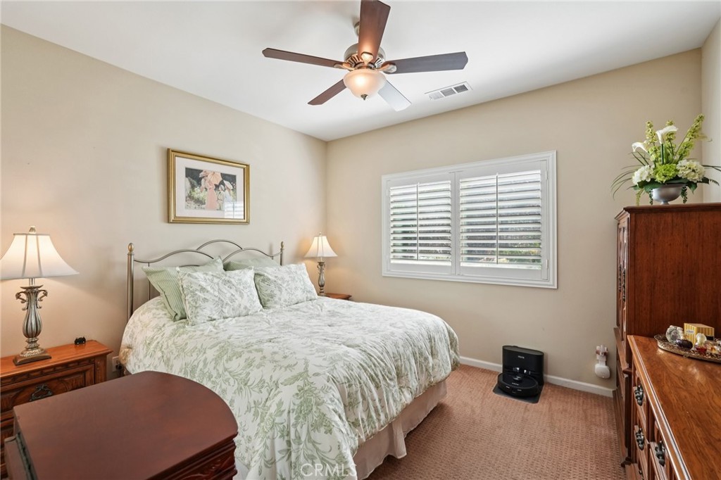 36274 Waxen Road Lake Elsinore, CA 92532 - Photo 32 of 65 a bedroom with a bed dresser and a window