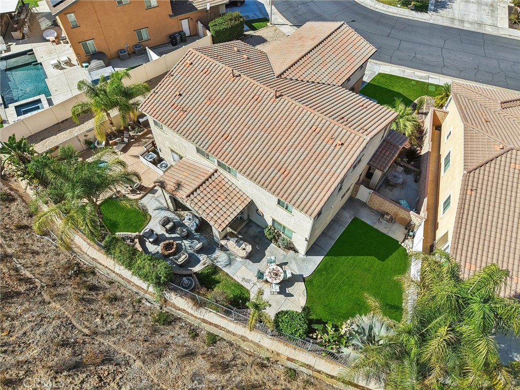 36274 Waxen Road Lake Elsinore, CA 92532 - Photo 48 of 65 an aerial view of a house with a yard and potted plants