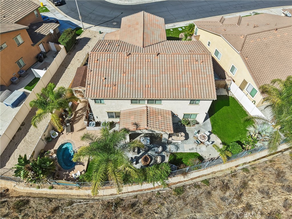 36274 Waxen Road Lake Elsinore, CA 92532 - Photo 49 of 65 an aerial view of a house with a yard and potted plants