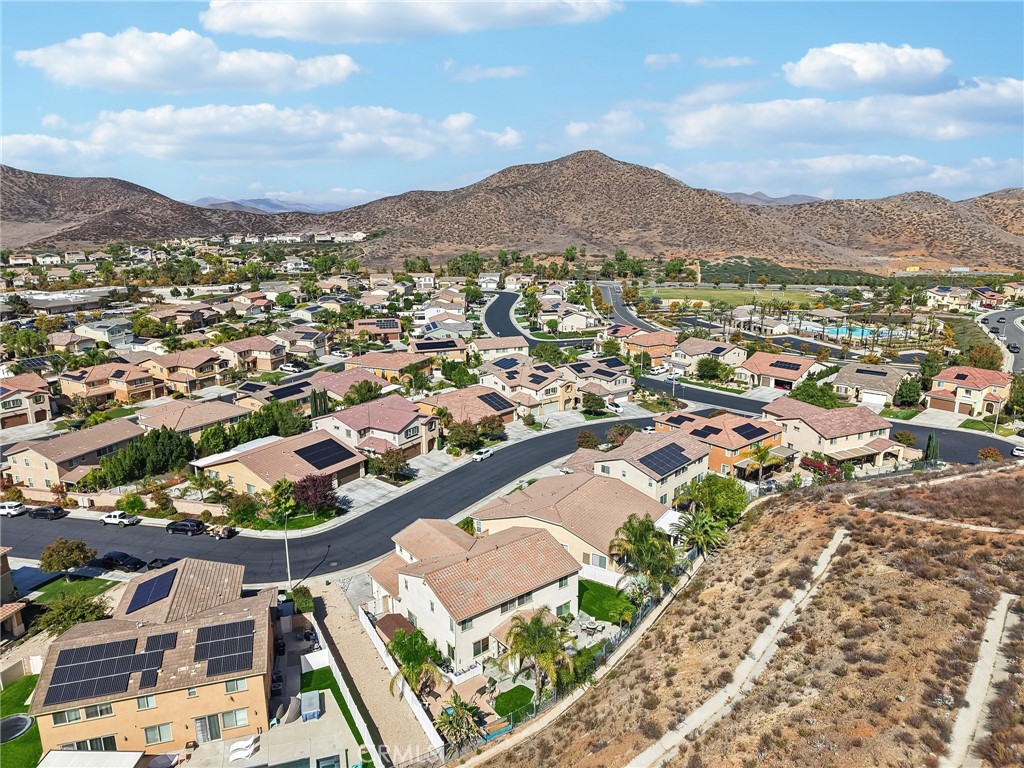 36274 Waxen Road Lake Elsinore, CA 92532 - Photo 51 of 65 an aerial view of residential houses with outdoor space and trees