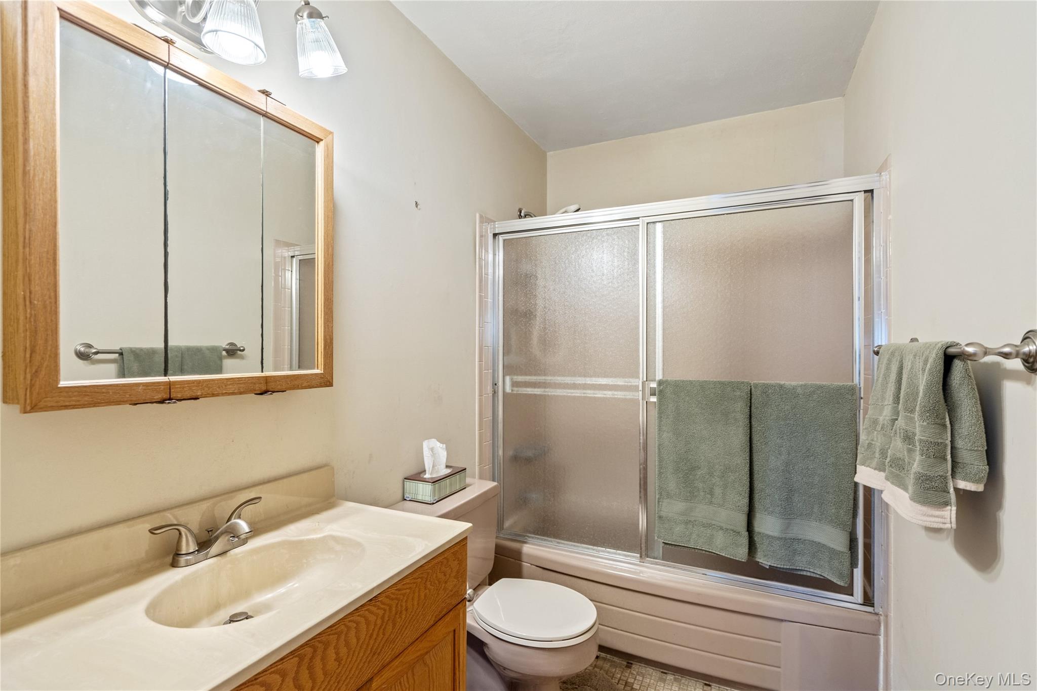 211 Mooney Pond Road Selden, NY 11784 - Photo 16 of 41 a bathroom with a sink toilet and shower