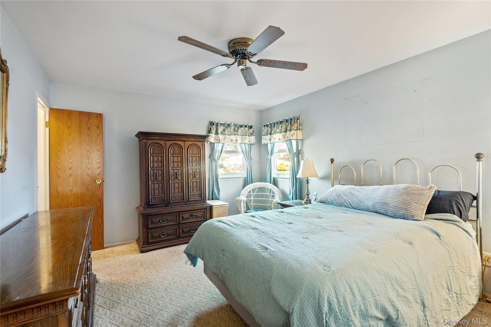 211 Mooney Pond Road Selden, NY 11784 - Photo 17 of 41 a bedroom with a bed and window