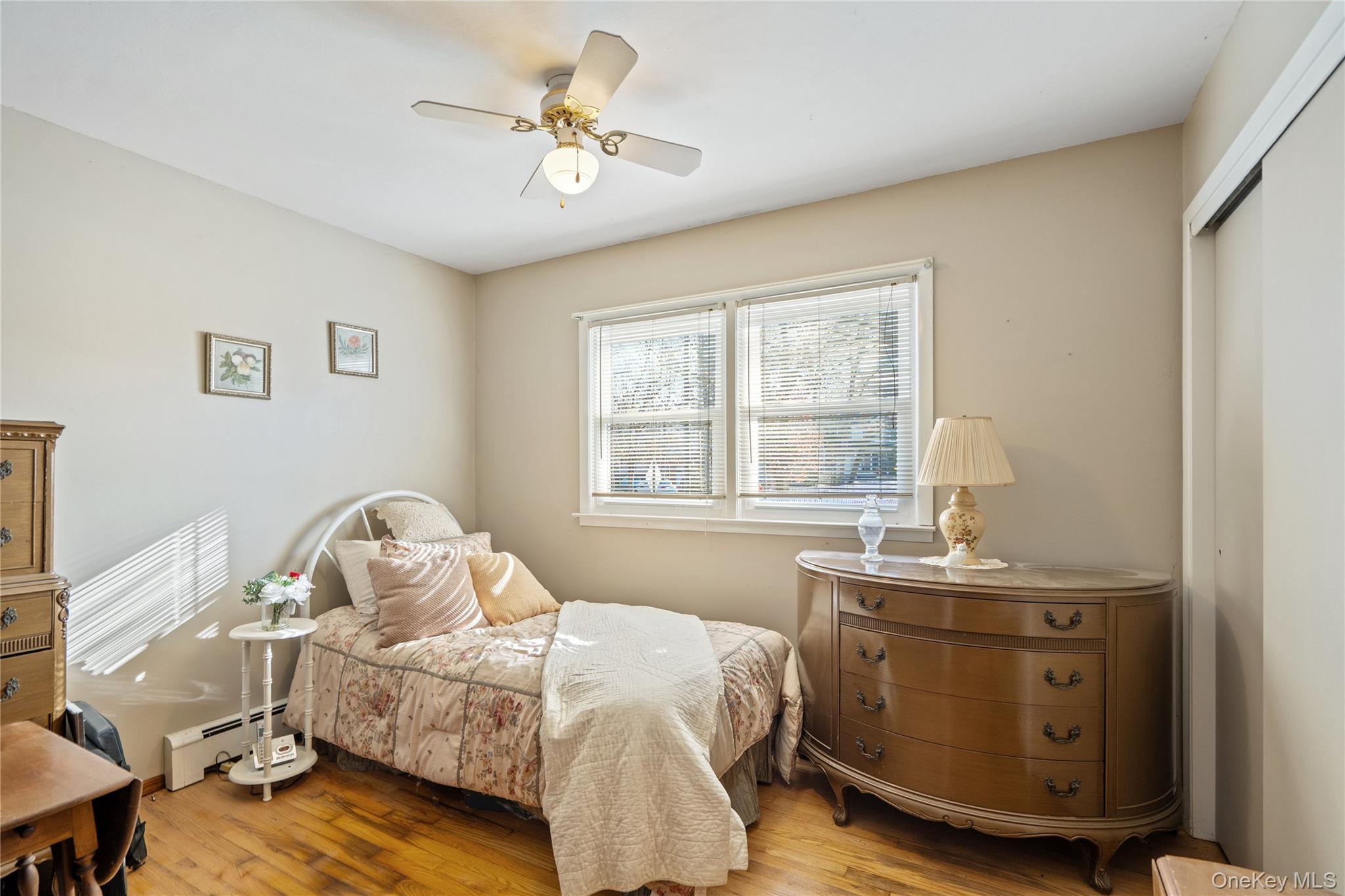 211 Mooney Pond Road Selden, NY 11784 - Photo 20 of 41 a bedroom with a bed and a window