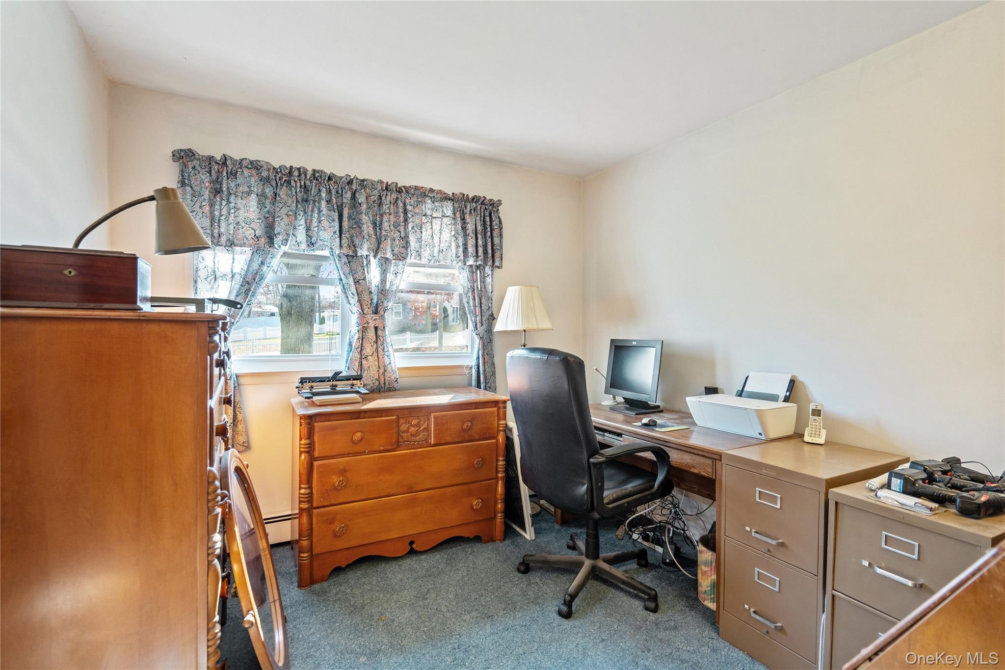 211 Mooney Pond Road Selden, NY 11784 - Photo 21 of 41 a view of a workspace with furniture and a window