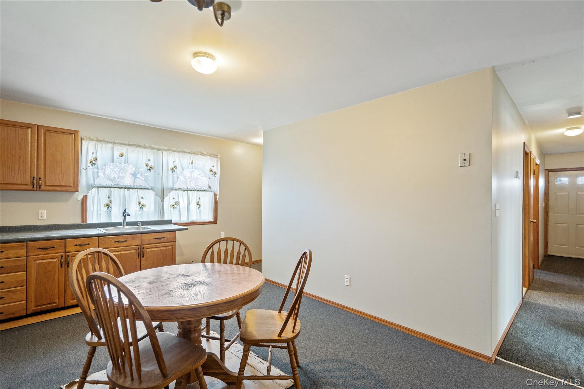 211 Mooney Pond Road Selden, NY 11784 - Photo 22 of 41 a dining room with furniture and window