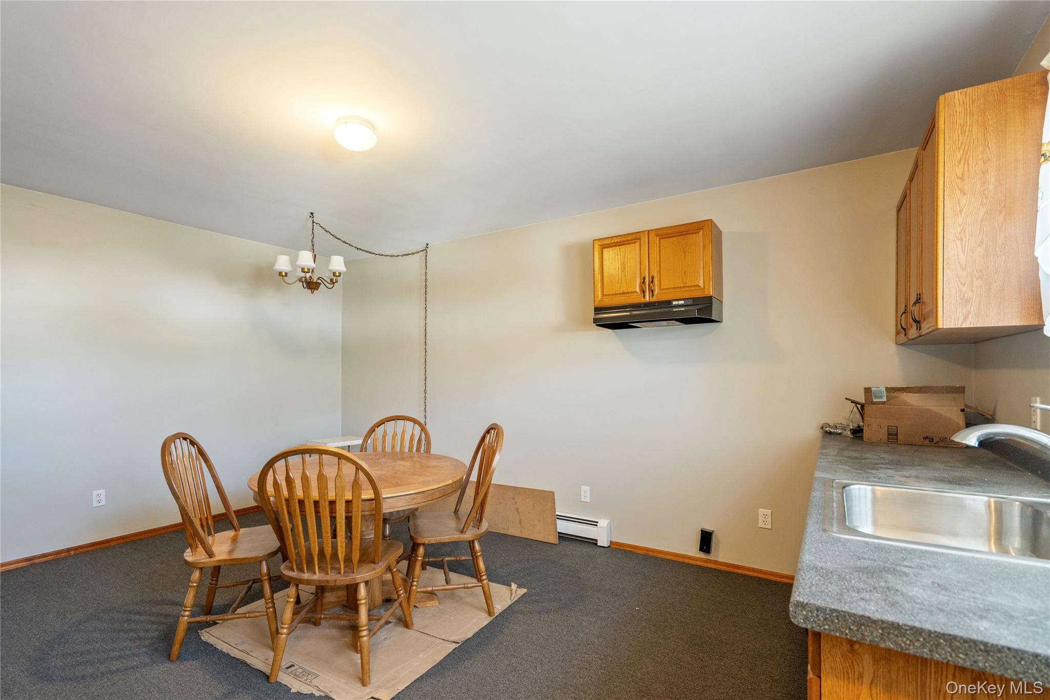 211 Mooney Pond Road Selden, NY 11784 - Photo 23 of 41 a view of a dining room with furniture and window