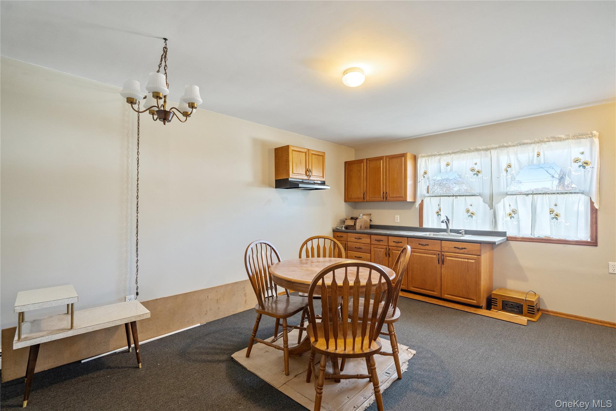 211 Mooney Pond Road Selden, NY 11784 - Photo 24 of 41 a view of a dining room with furniture window and wooden floor