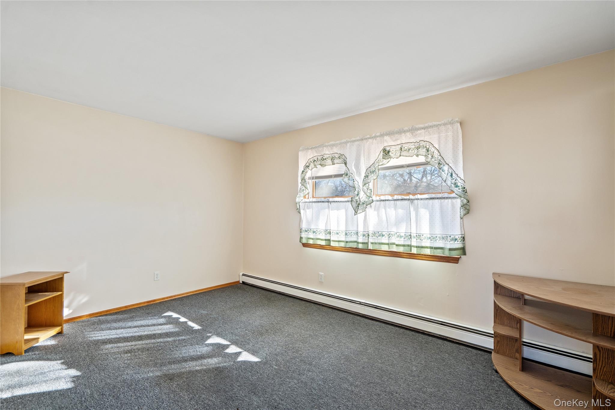 211 Mooney Pond Road Selden, NY 11784 - Photo 26 of 41 a view of an empty room with a window