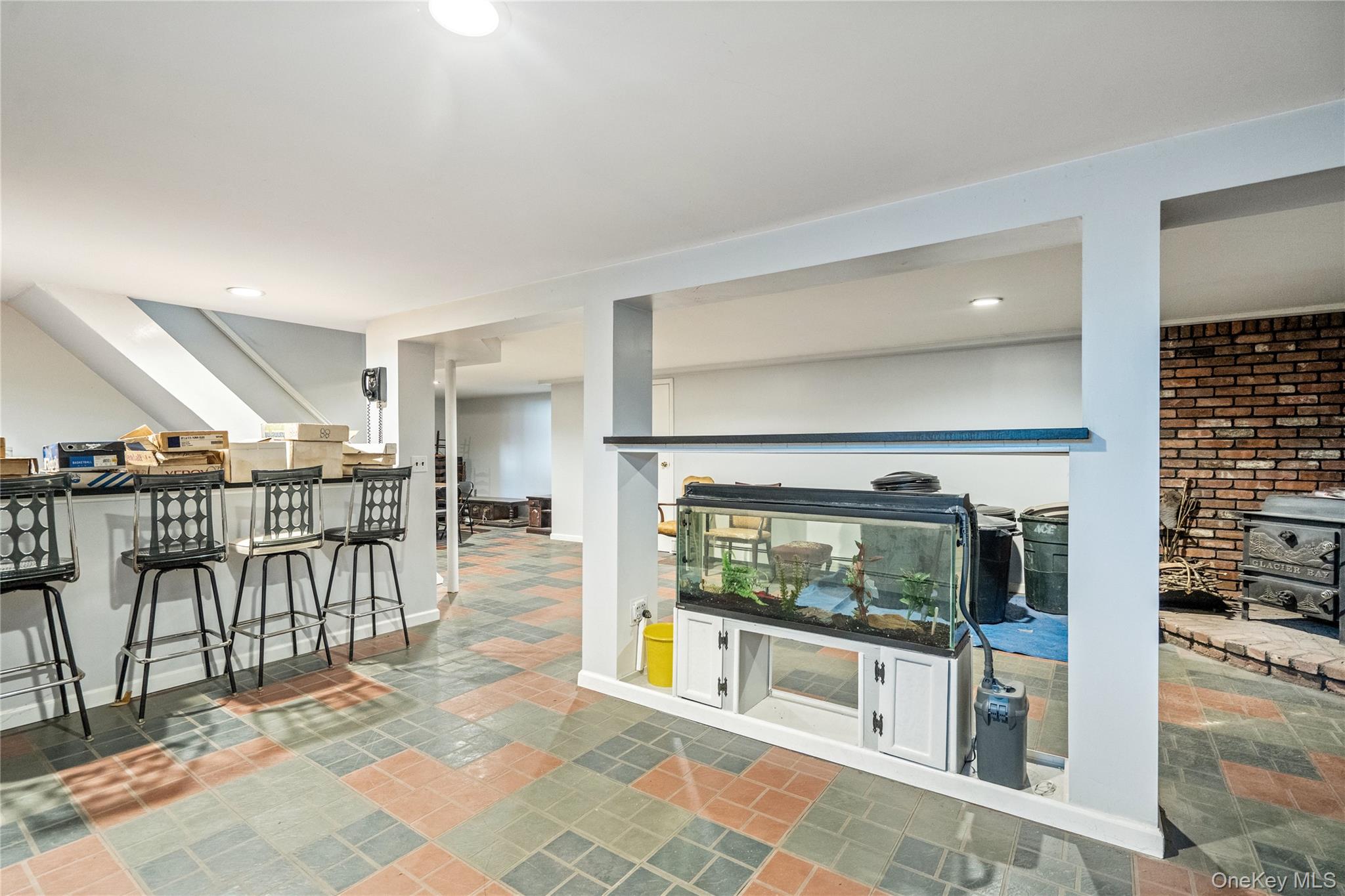 211 Mooney Pond Road Selden, NY 11784 - Photo 30 of 41 a lobby with furniture and a floor to ceiling window