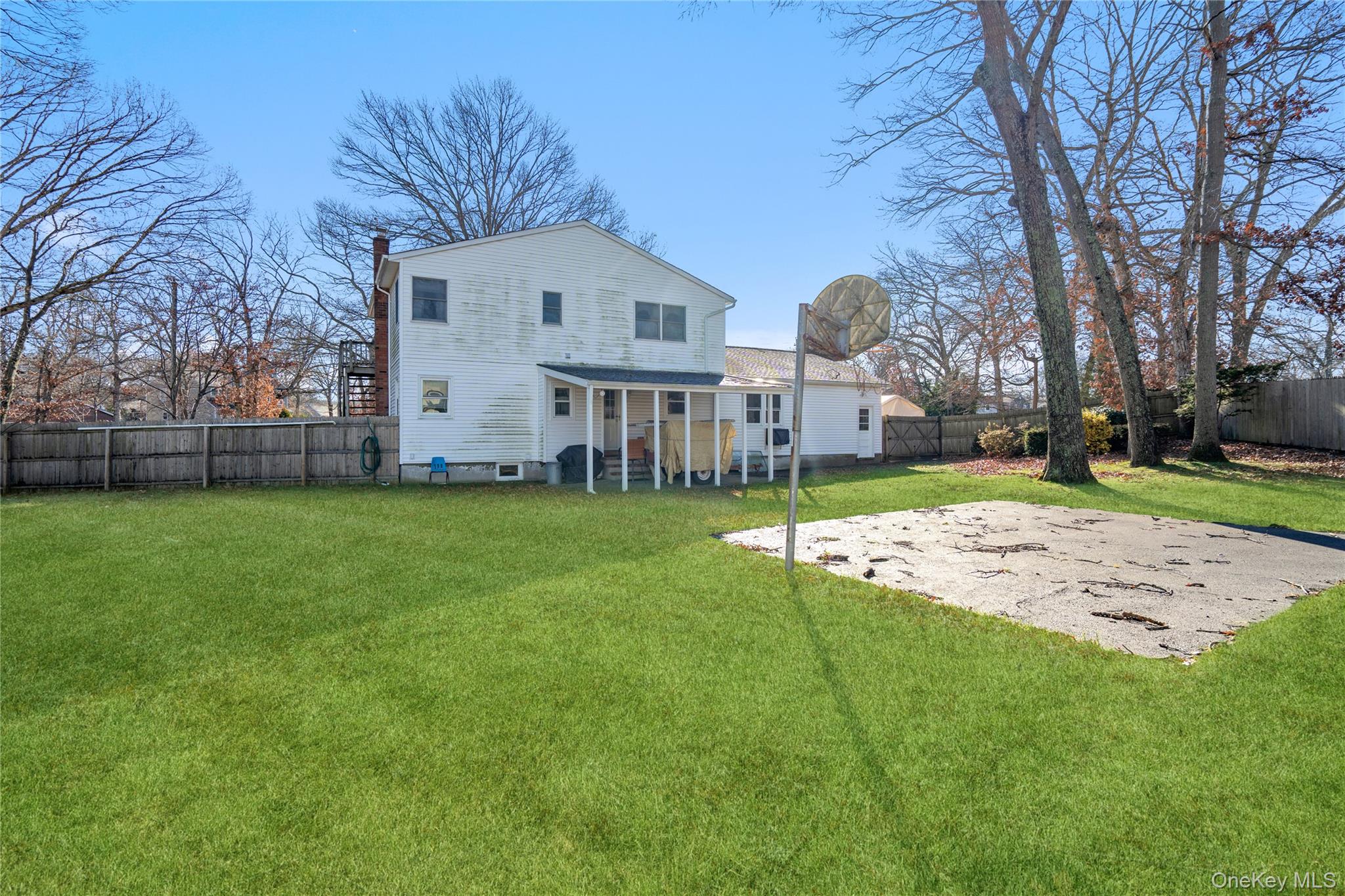 211 Mooney Pond Road Selden, NY 11784 - Photo 32 of 41 a view of a house with a big yard and large tree