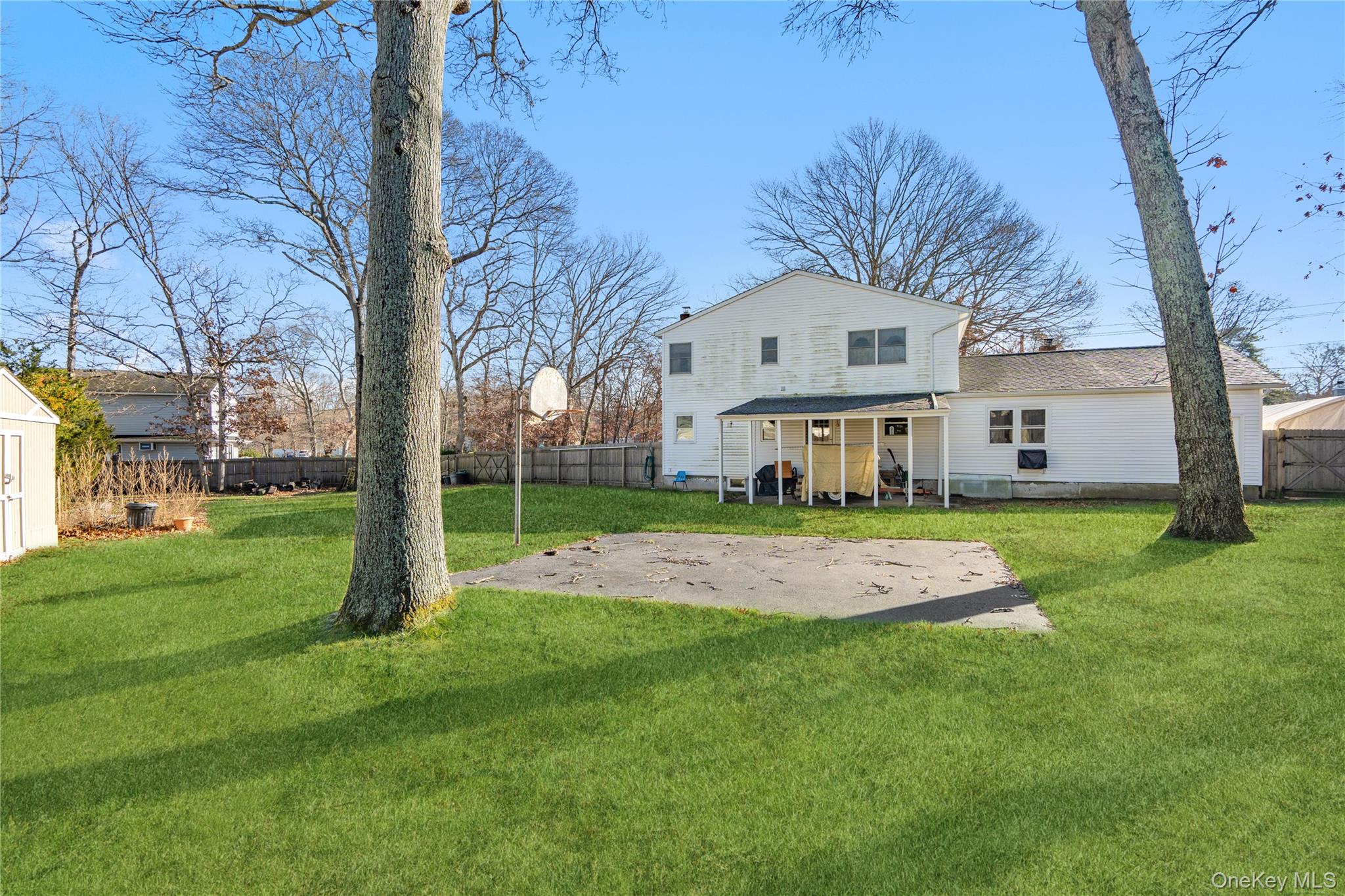 211 Mooney Pond Road Selden, NY 11784 - Photo 33 of 41 a view of a house with a big yard