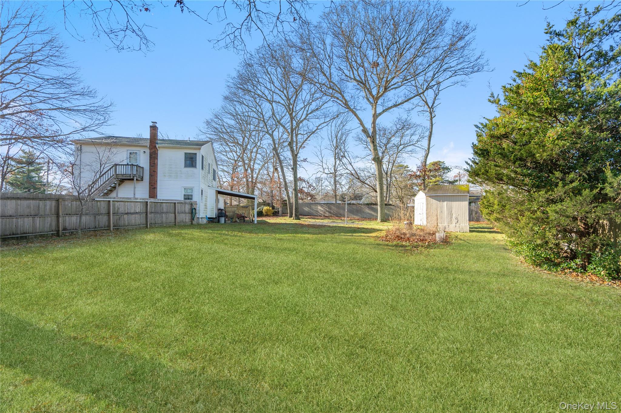 211 Mooney Pond Road Selden, NY 11784 - Photo 36 of 41 a view of a house with a yard