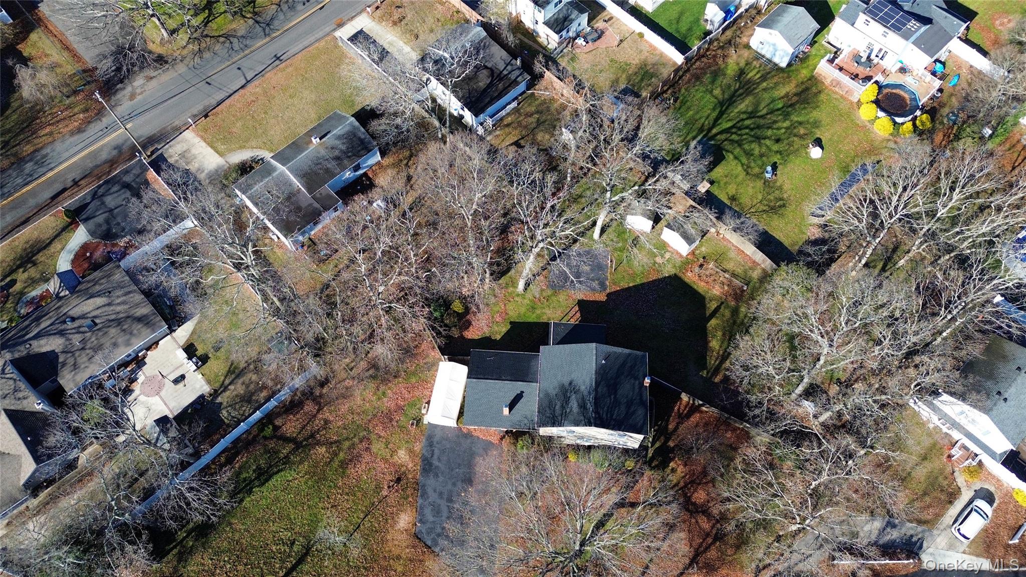 211 Mooney Pond Road Selden, NY 11784 - Photo 38 of 41 a view of a house with a yard