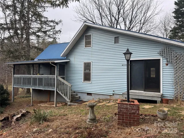 a front view of a house with stairs