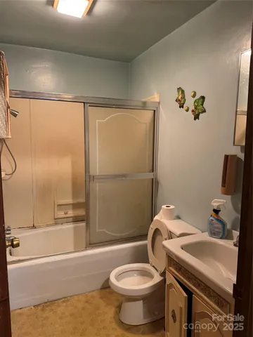 a kitchen that has a stove and a table