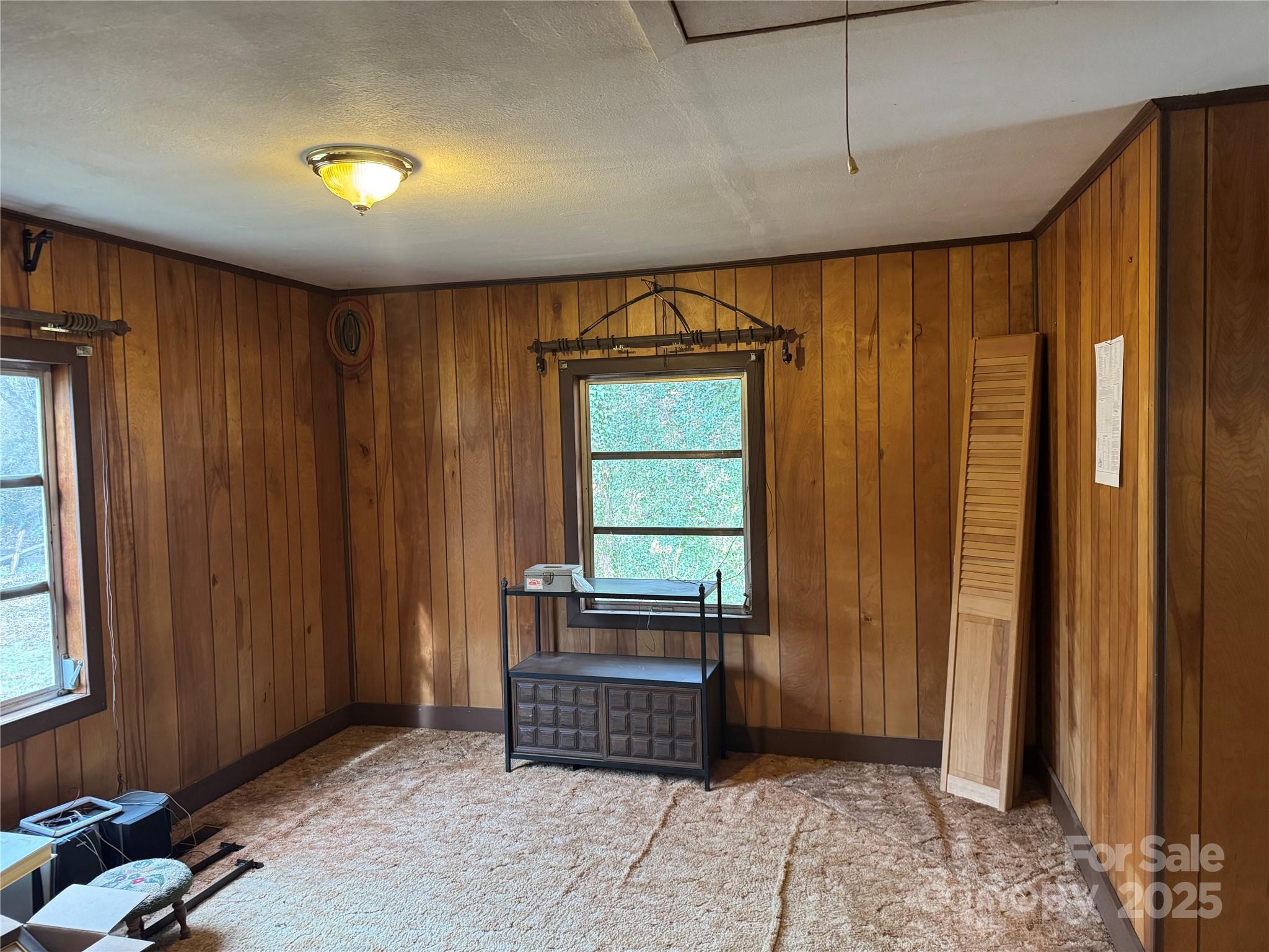 201 Tinsley Road Brevard, NC 28712 - Photo 19 of 23 a living room with a bed and a window