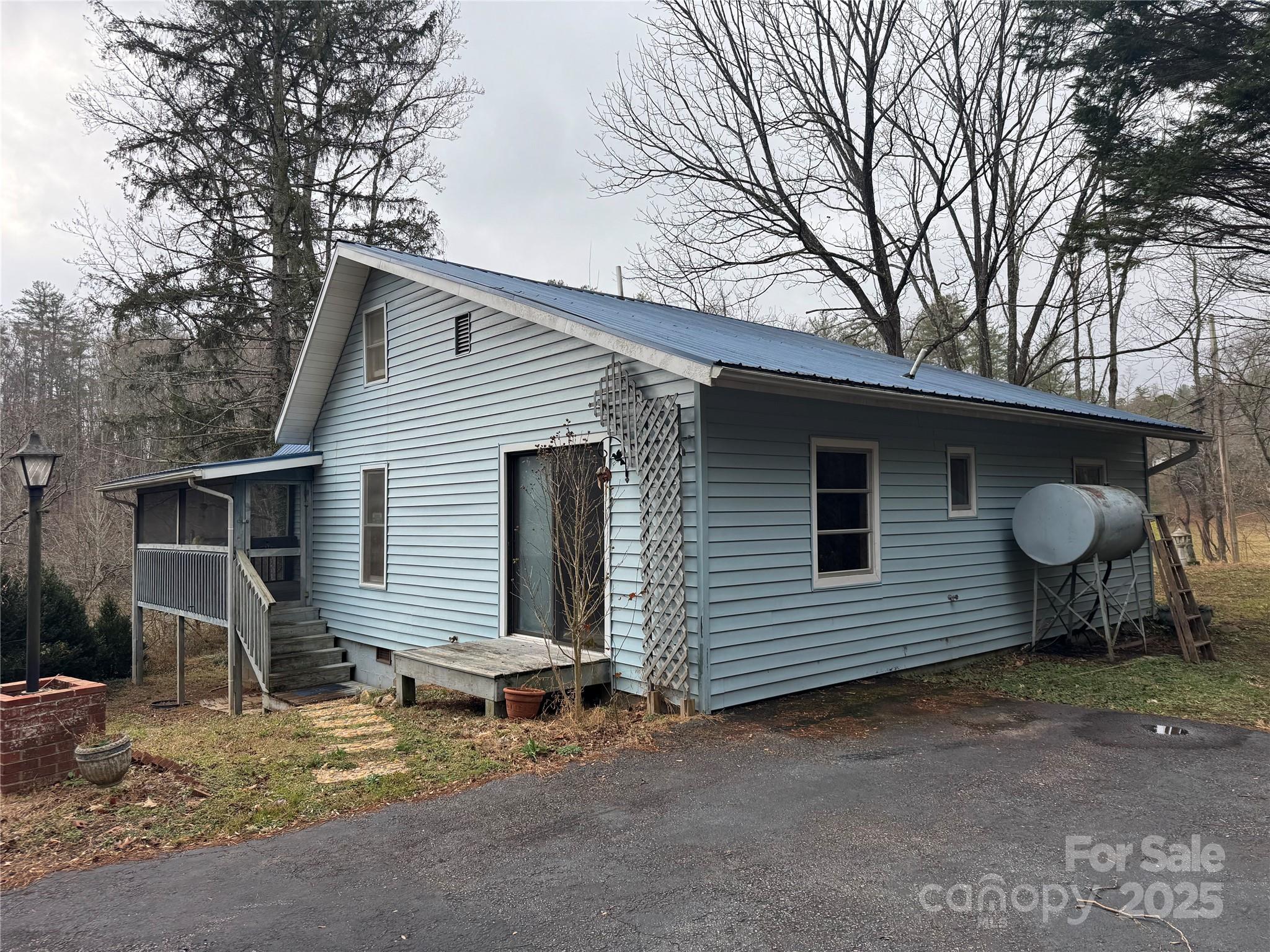 201 Tinsley Road Brevard, NC 28712 - Photo 2 of 23 a view of a house with a yard and wooden fence