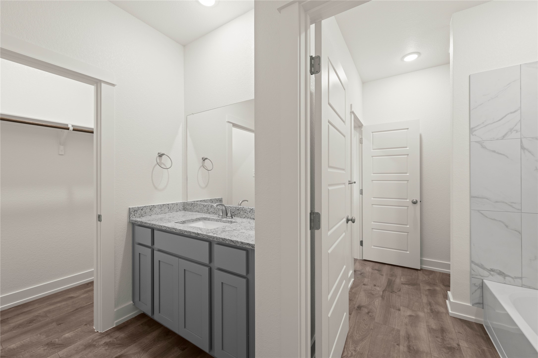564 Gus Loop Georgetown, TX 78626 - Photo 23 of 32 a bathroom with a granite countertop sink and a mirror