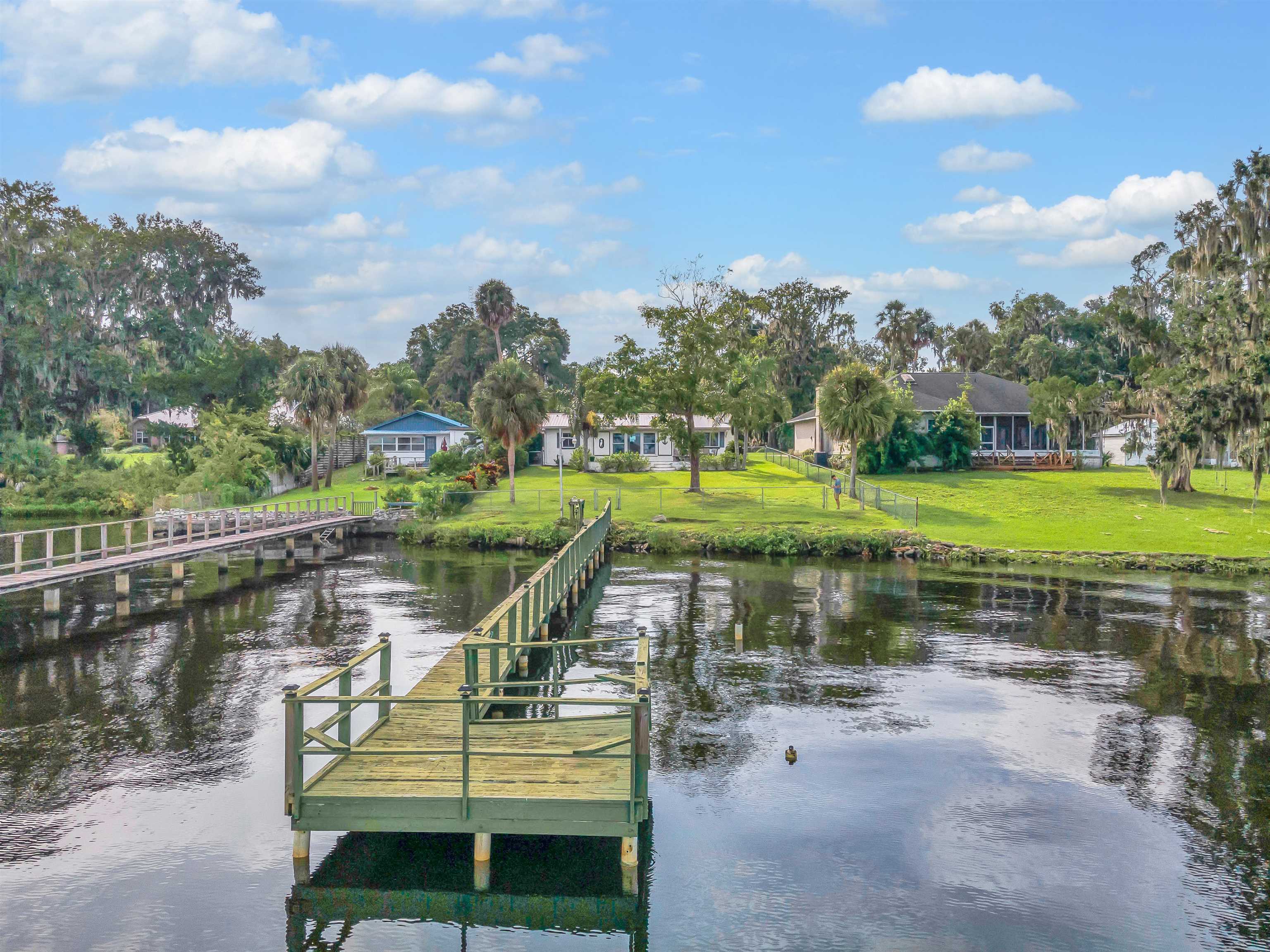 115 Sunset Point Road East Palatka, FL 32131 - Photo 13 of 67 Dock with a water view and a lawn