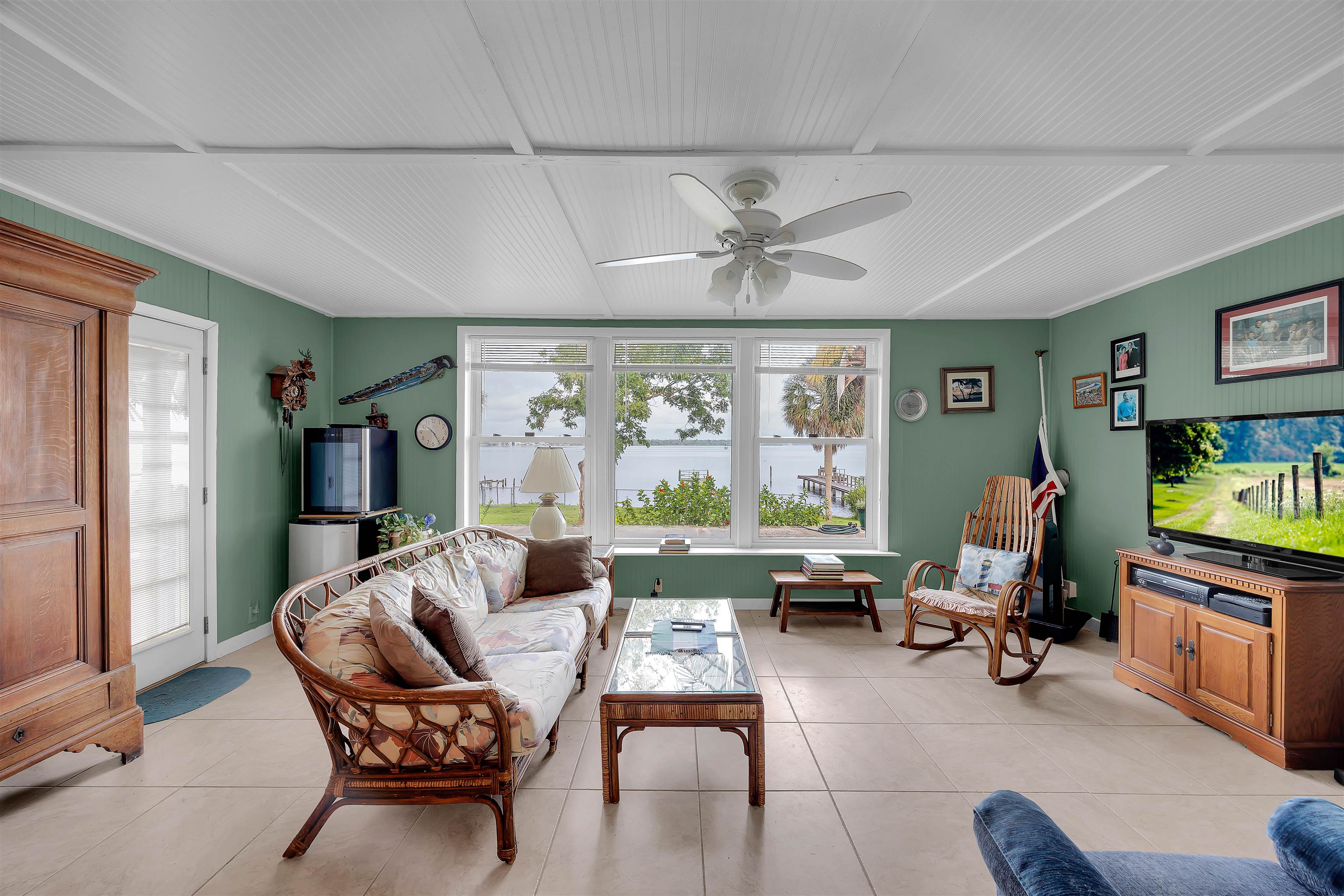 115 Sunset Point Road East Palatka, FL 32131 - Photo 37 of 67 florida room featuring light tile patterned flooring and a ceiling fan