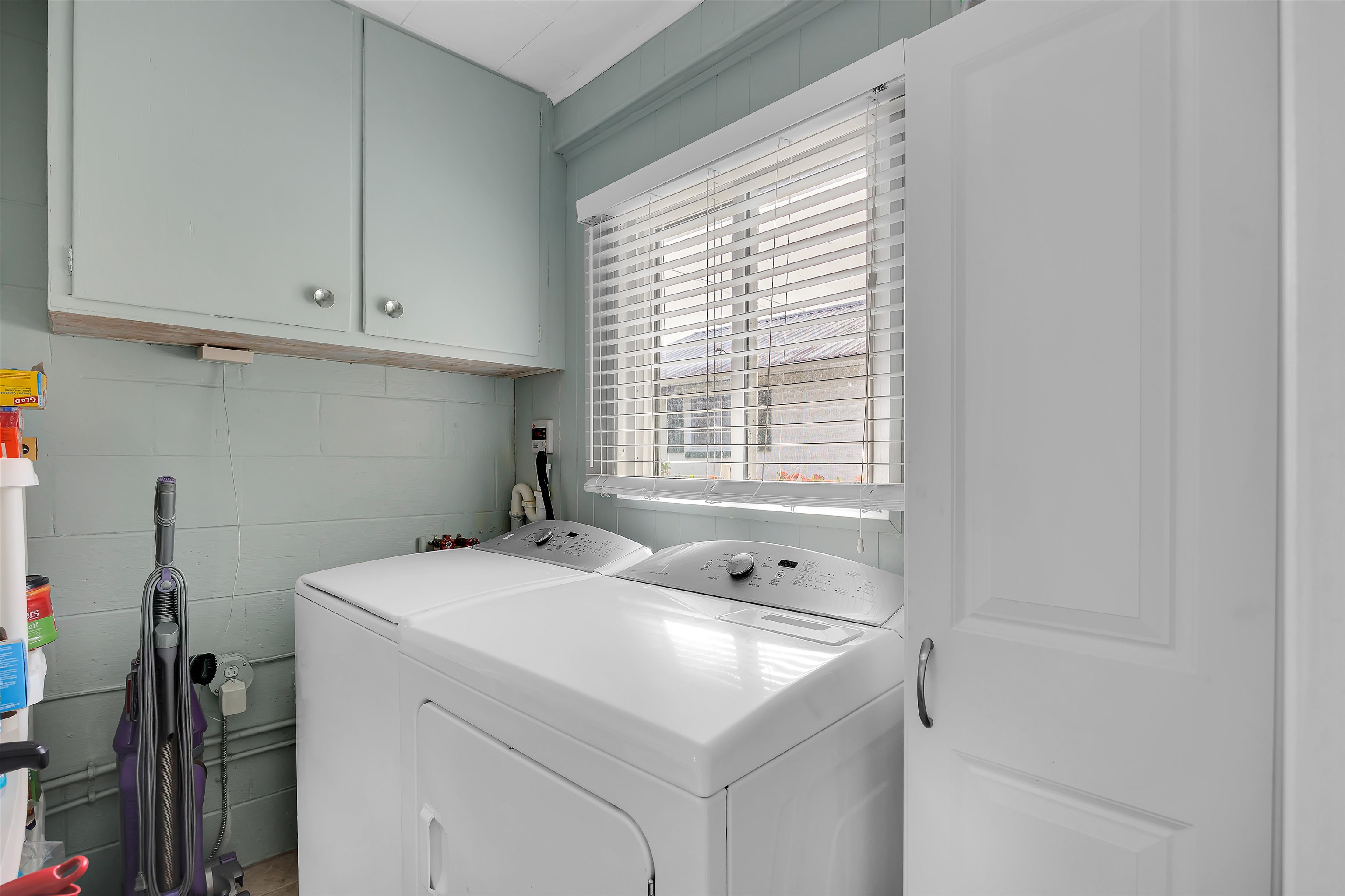115 Sunset Point Road East Palatka, FL 32131 - Photo 39 of 67 Washroom with washing machine and clothes dryer and cabinet space