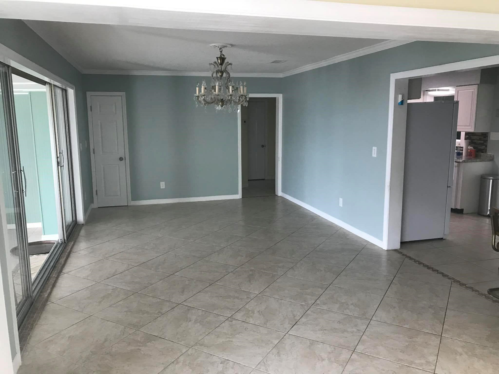 115 Sunset Point Road East Palatka, FL 32131 - Photo 47 of 67 Unfurnished dining area with ornamental molding, light tile patterned floors, and a chandelier