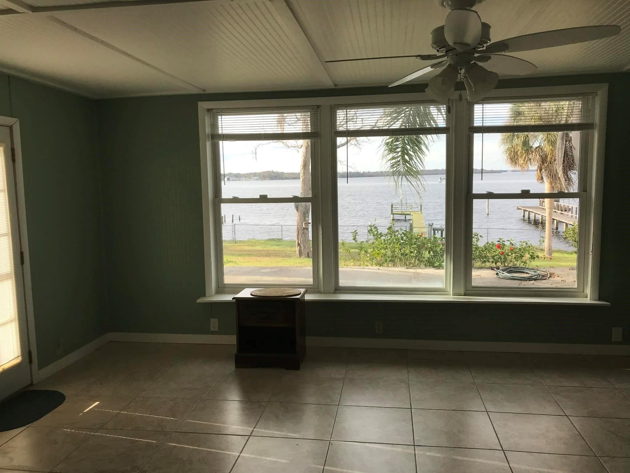 115 Sunset Point Road East Palatka, FL 32131 - Photo 61 of 67 Tiled spare room with a water view and ceiling fan