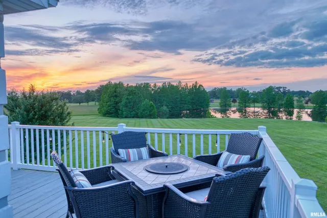a view of a chairs and table in the yard