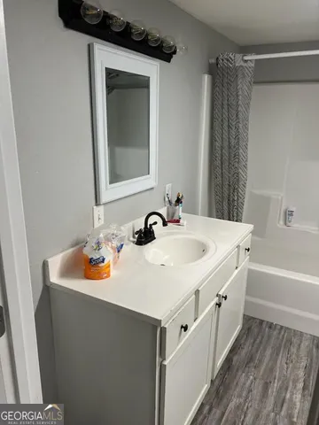 a bathroom with a sink and a mirror