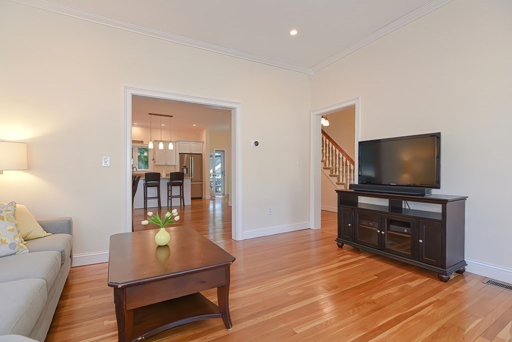 228 Cherry Street Newton, MA 02465 - Photo 18 of 42 a living room with furniture and a flat screen tv