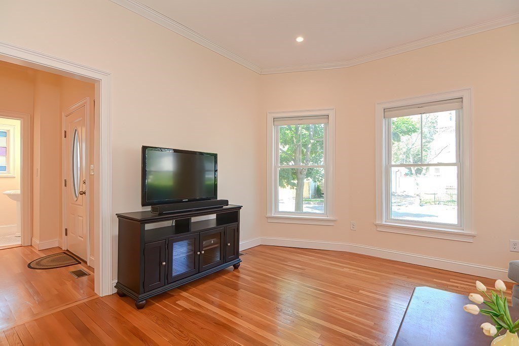 228 Cherry Street Newton, MA 02465 - Photo 20 of 42 a living room with furniture and a flat screen tv