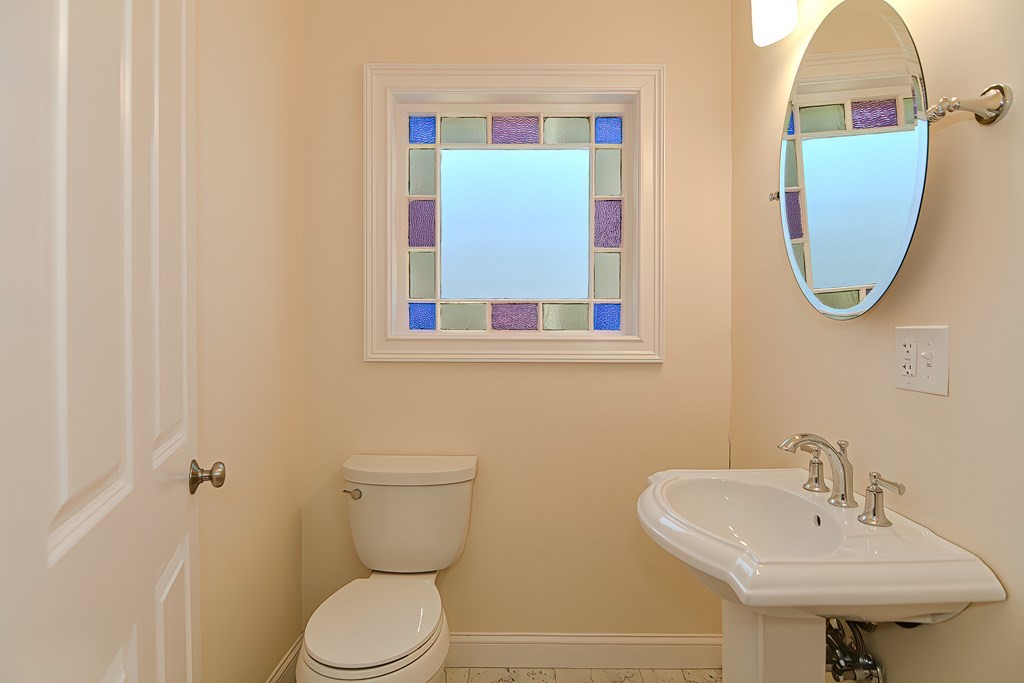 228 Cherry Street Newton, MA 02465 - Photo 22 of 42 a bathroom with a toilet sink and mirror