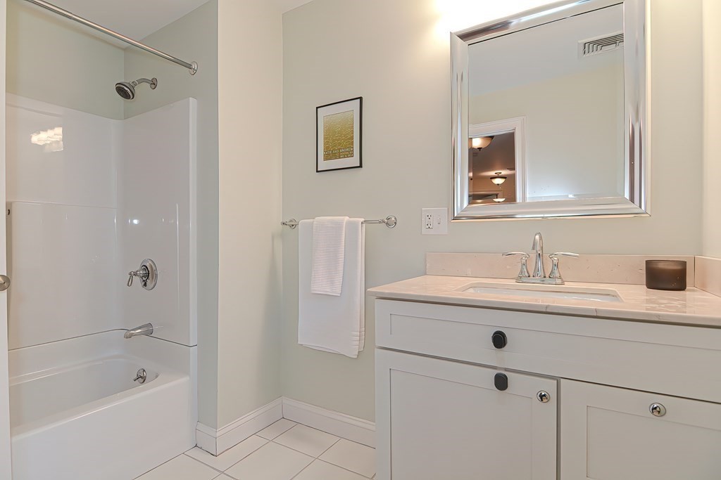 228 Cherry Street Newton, MA 02465 - Photo 25 of 42 a bathroom with a sink and a mirror
