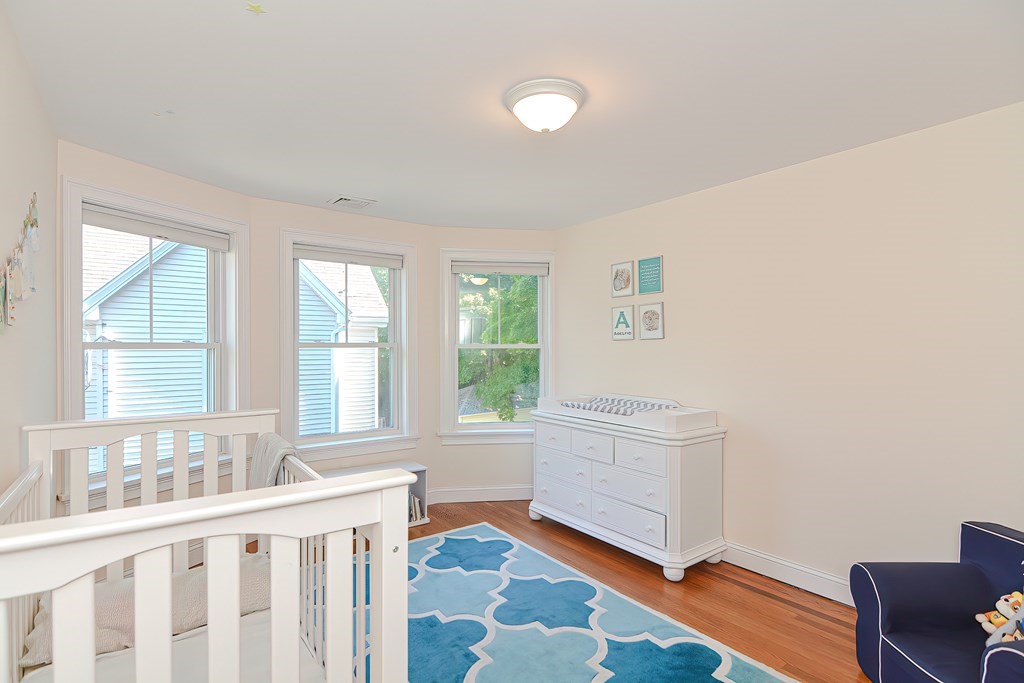 228 Cherry Street Newton, MA 02465 - Photo 27 of 42 a room with a bed and a window