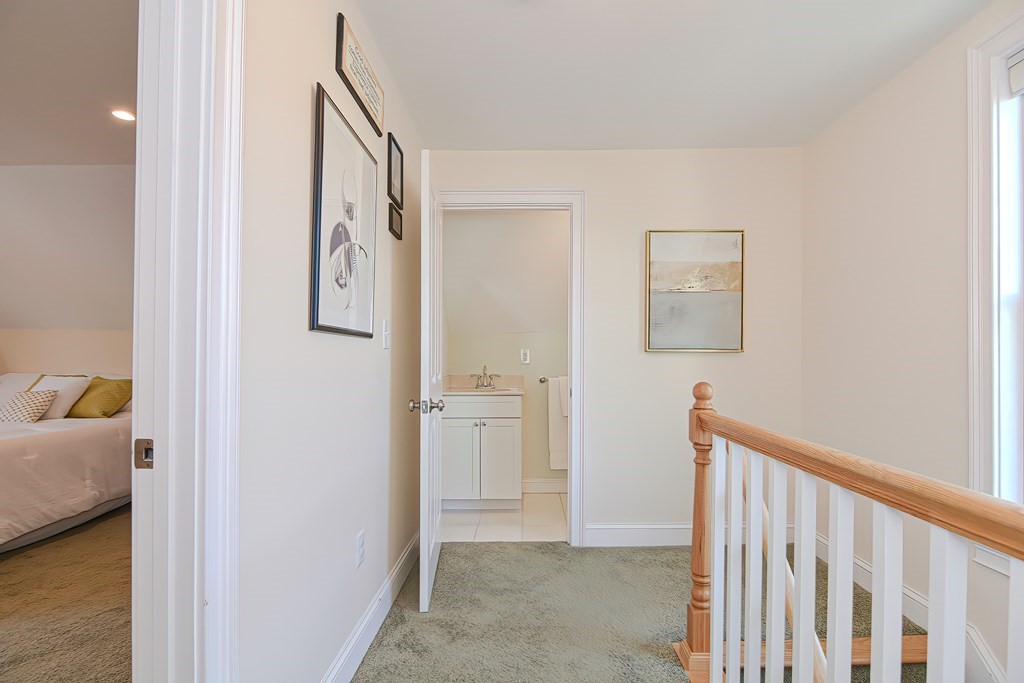 228 Cherry Street Newton, MA 02465 - Photo 37 of 42 a view of a hallway with closet and wooden floor