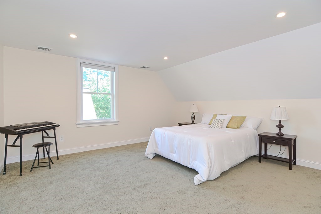 228 Cherry Street Newton, MA 02465 - Photo 39 of 42 a bedroom with a bed and a window