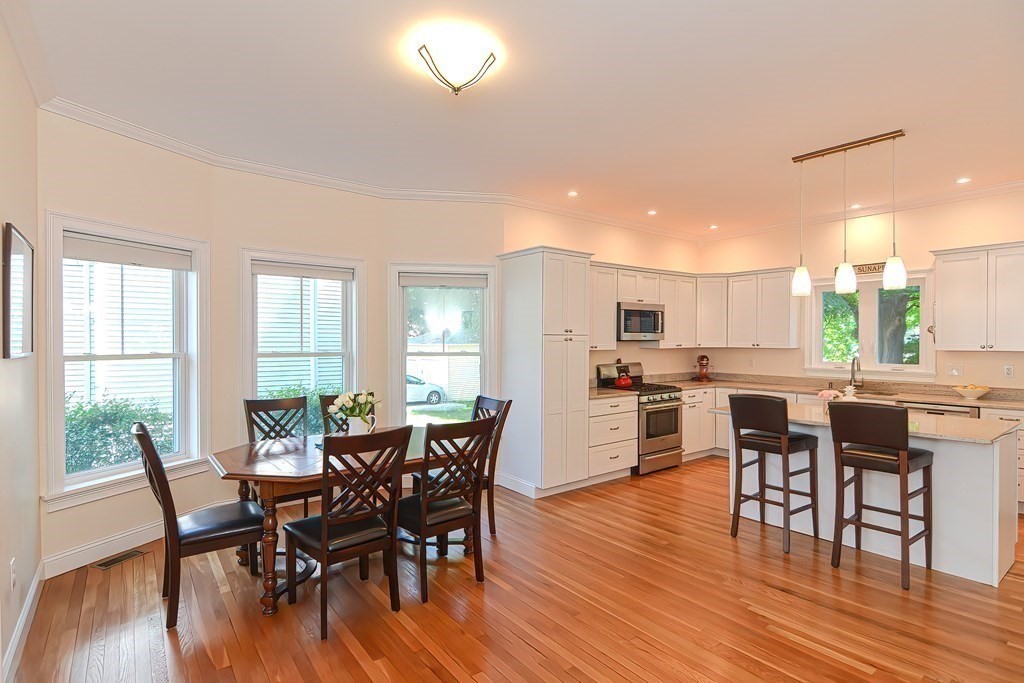228 Cherry Street Newton, MA 02465 - Photo 4 of 42 a view of a dining room with furniture and wooden floor