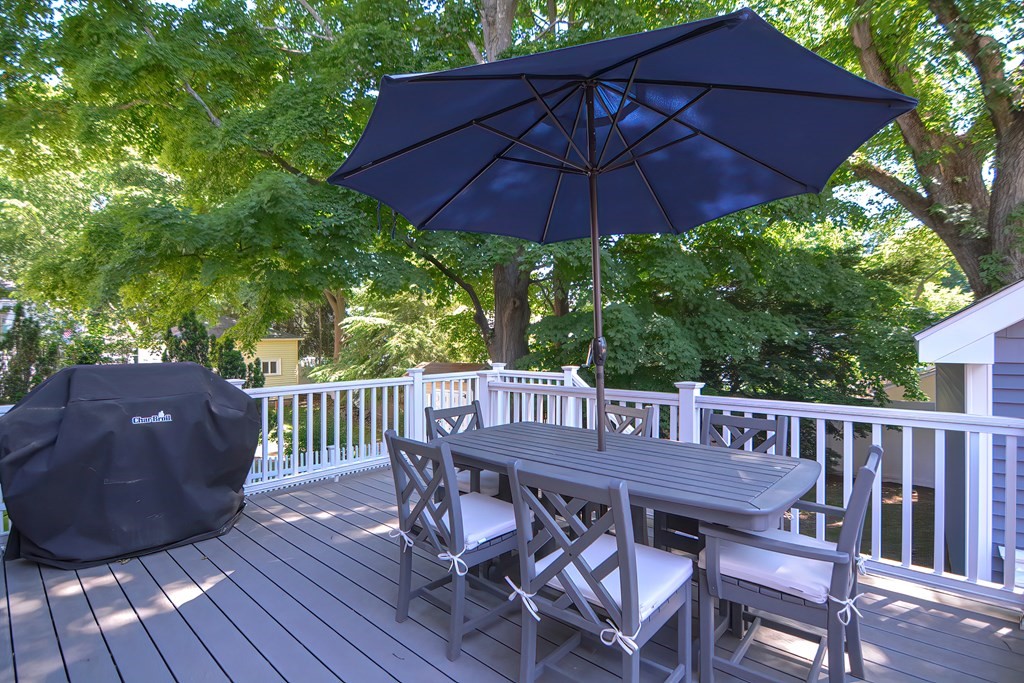 228 Cherry Street Newton, MA 02465 - Photo 41 of 42 a view of backyard with a patio and wooden furniture