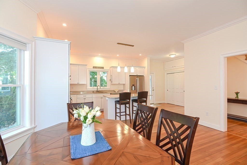 228 Cherry Street Newton, MA 02465 - Photo 9 of 42 a view of a dining room with furniture window and wooden floor